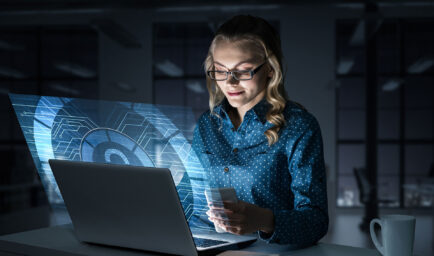 woman viewing futuristic laptop