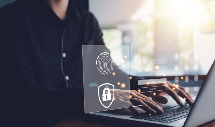 A man works on a laptop and a translucent security lock, biometric fingerprint and login page appear on screen.